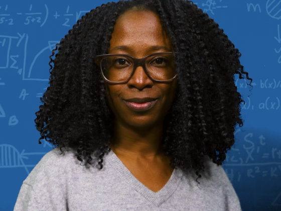 headshot of prof Ayana Arce, Black woman with glasses and grey sweater